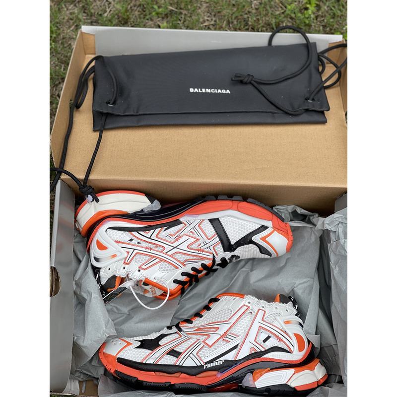 kith x Ba*len*cia*ga runner sneaker white/orange/black