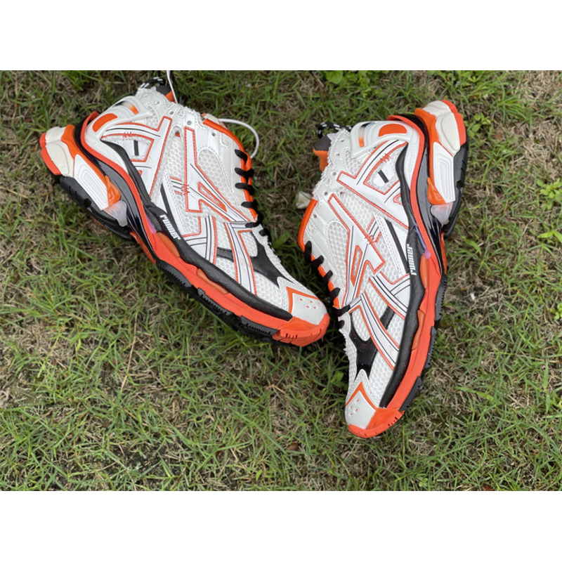 kith x Ba*len*cia*ga runner sneaker white/orange/black