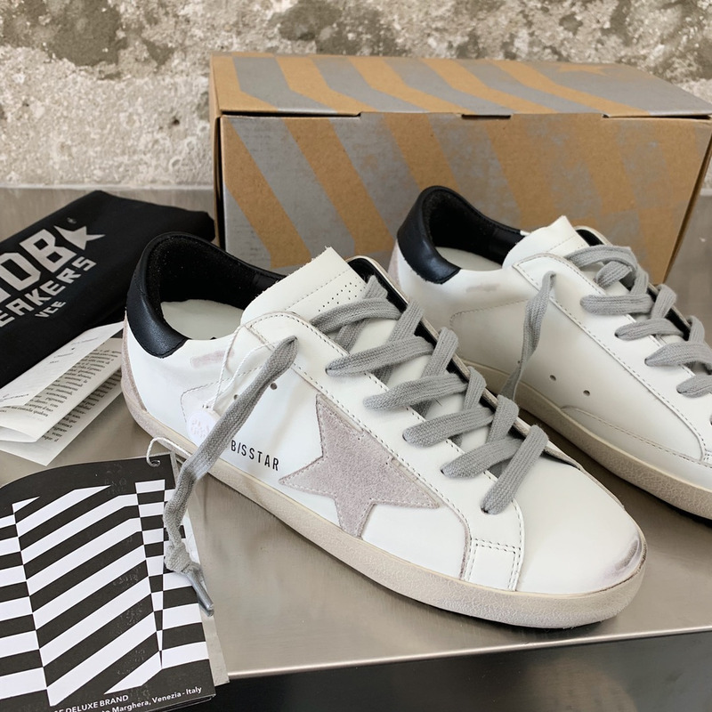 golden goose men’s S*per-star sneakers with suede star and black heel tab