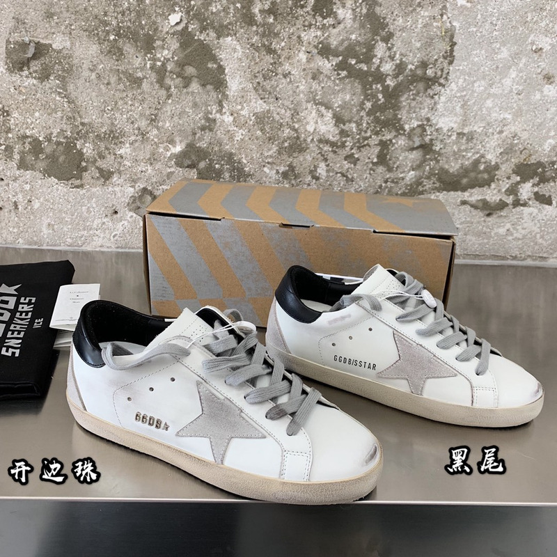 golden goose men’s S*per-star sneakers with suede star and black heel tab