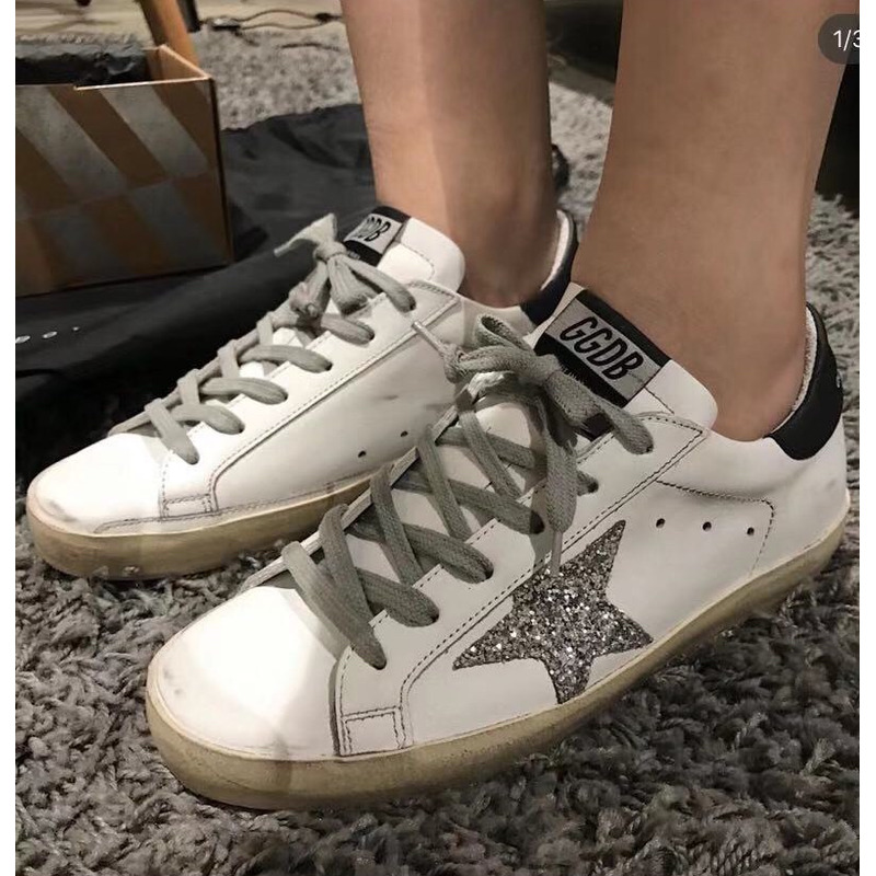 golden goose men’s S*per-star sneakers with silver star and black heel tab