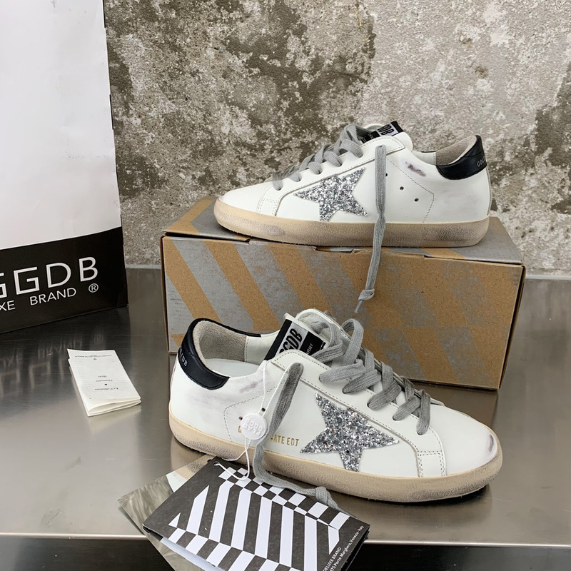 golden goose S*per-star sneakers with sliver glitter and black heel tab