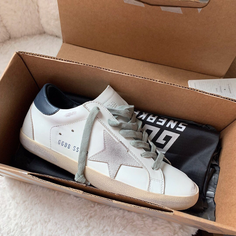 golden goose men’s S*per-star sneakers with suede star and blue heel tab