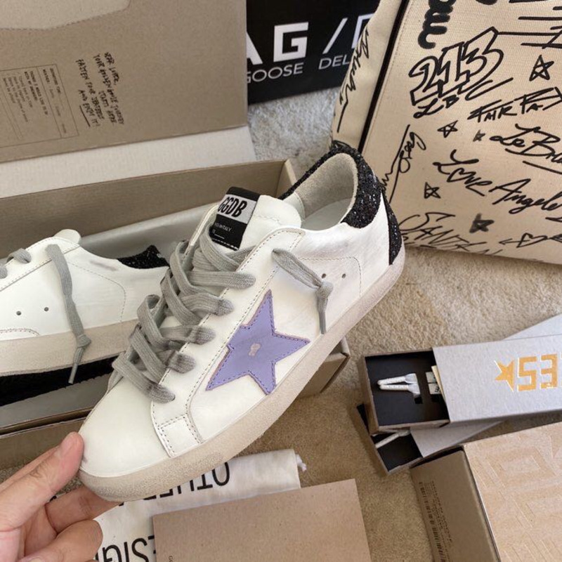 golden goose S*per-star sneakers with purple star logo and black heel tab