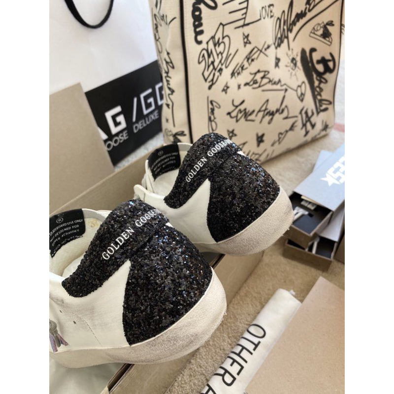 golden goose S*per-star sneakers with purple star logo and black heel tab
