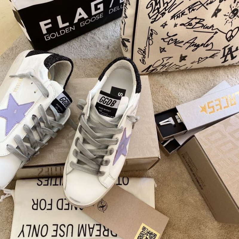 golden goose S*per-star sneakers with purple star logo and black heel tab