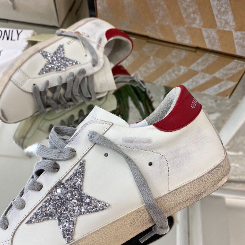 golden goose S*per-star sneakers with sliver glitter and red heel tab