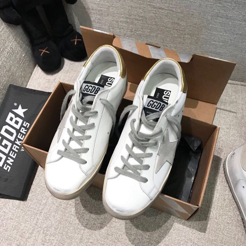 golden goose men’s S*per-star sneakers with suede star and golden heel tab