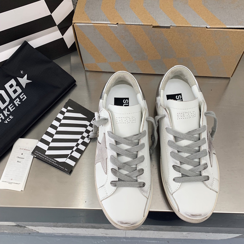golden goose men’s S*per-star sneakers with suede star and sliver heel tab