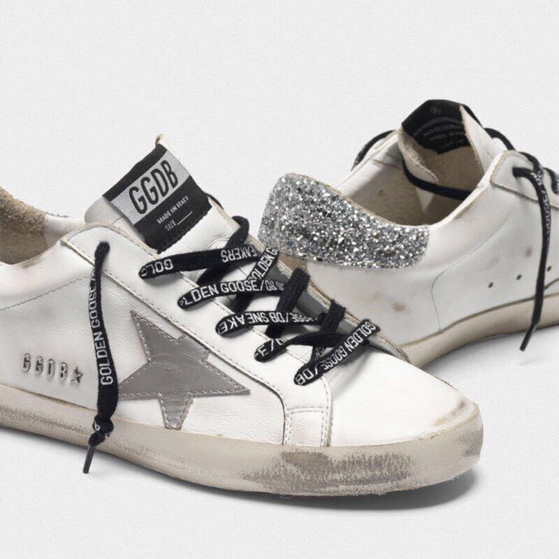 golden goose men’s S*per-star sneakers with suede star and sliver glitterheel tab
