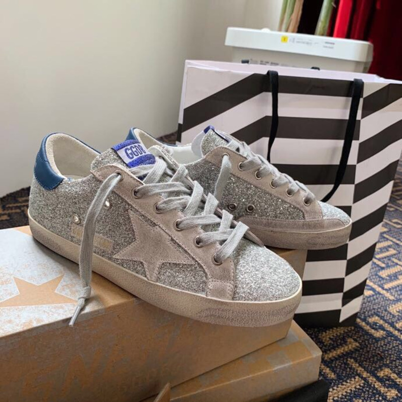 golden goose S*per-star sneakers with sliver glitter and blue heel tab