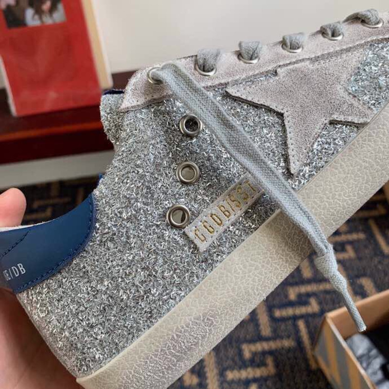 golden goose S*per-star sneakers with sliver glitter and blue heel tab