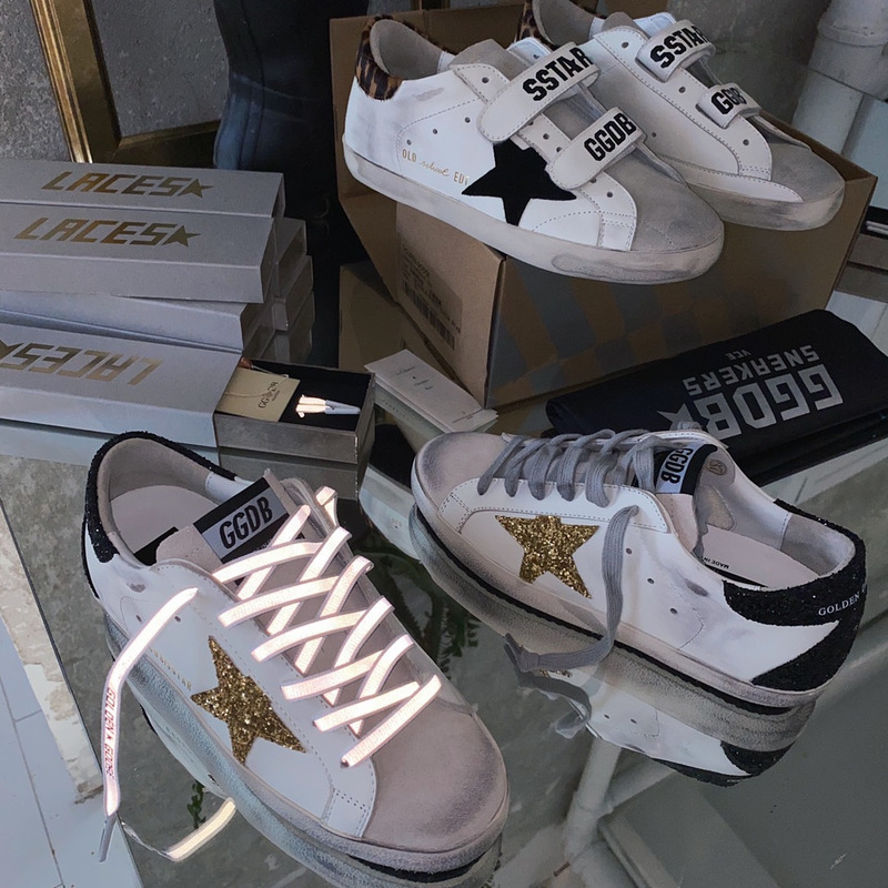 golden goose S*per-star sneakers with golden glitter and black heel tab