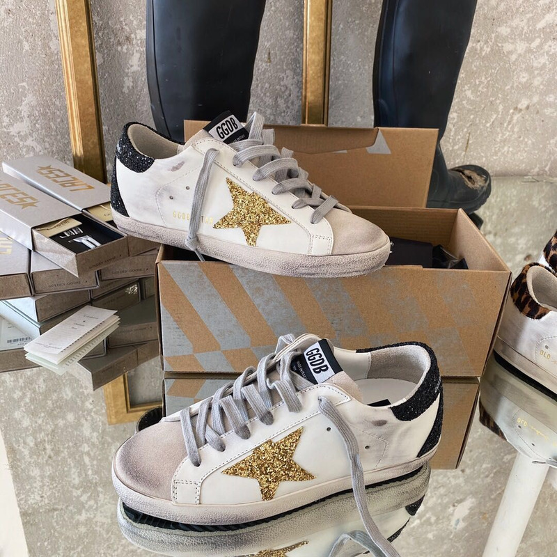 golden goose men’s S*per-star sneakers with golden glitter and black heel tab