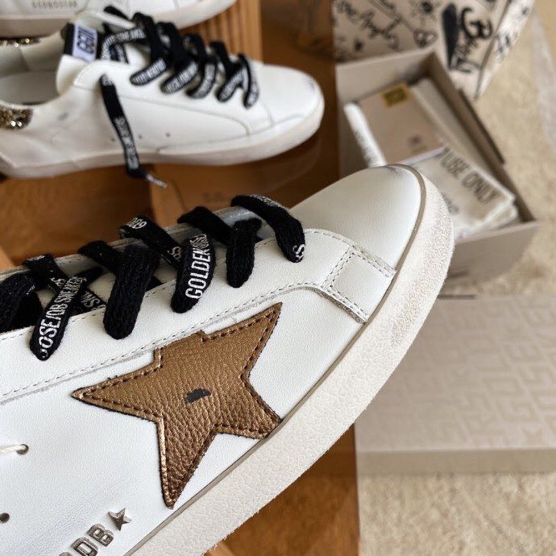 golden goose men’s S*per-star sneakers with brown suede star and glitter heel tab