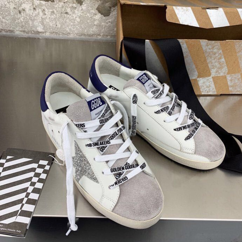 golden goose men’s S*per-star sneakers with sliver glitter star and blue heel tab