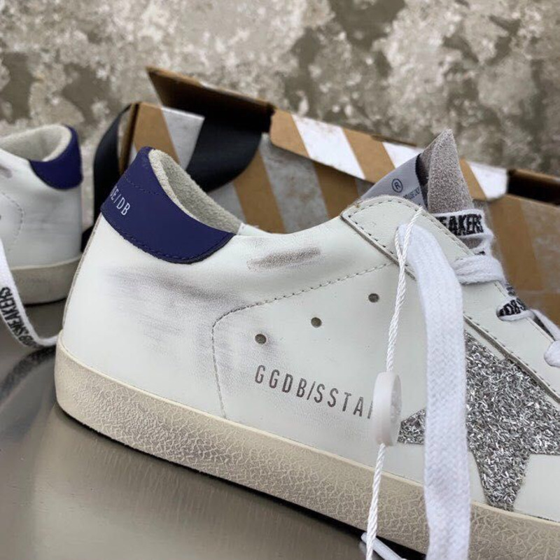 golden goose men’s S*per-star sneakers with sliver glitter star and blue heel tab