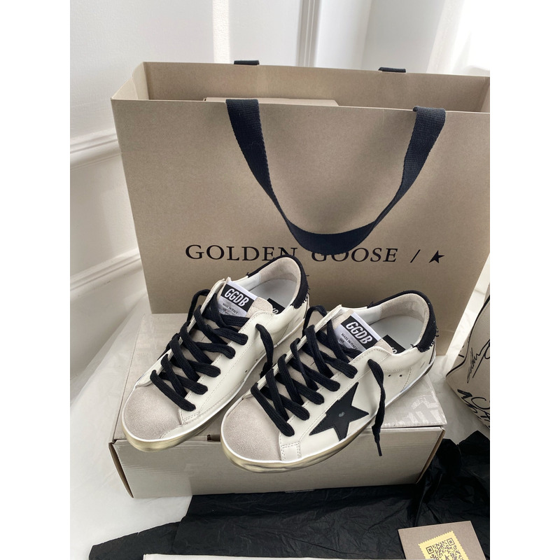 golden goose men’s S*per-star sneakers with black suede star and black heel tab