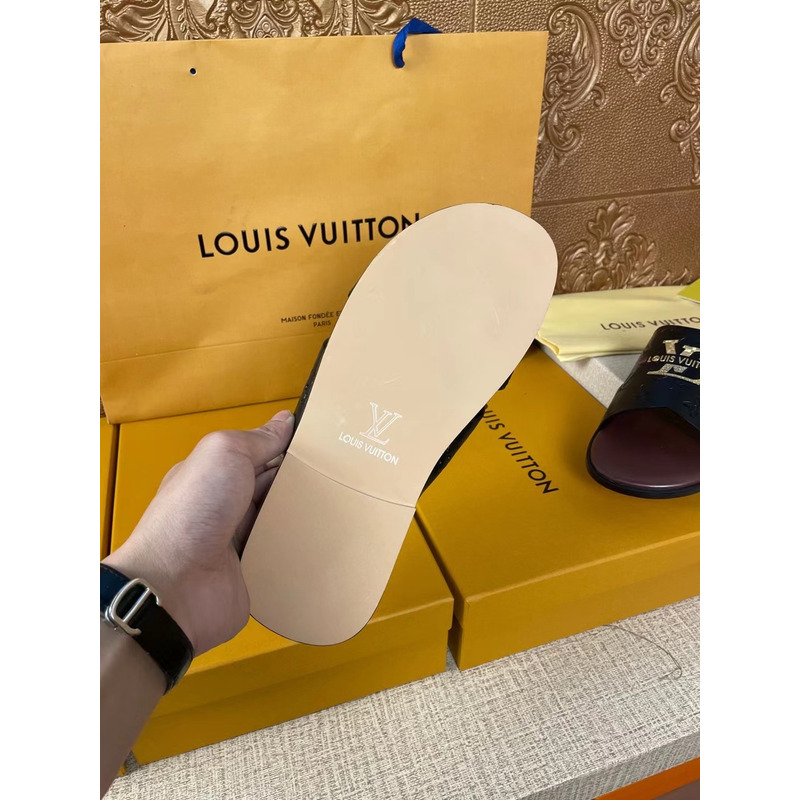 l**is V*t*n gold logo embossed monogram mules black/brown