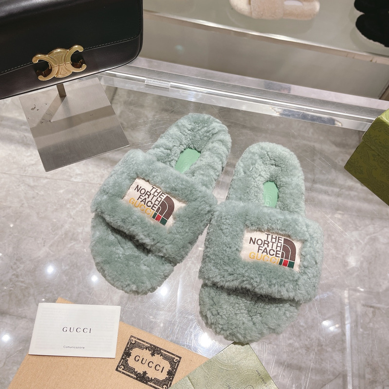 g*u*i x the n0*h F**e shearling slides green