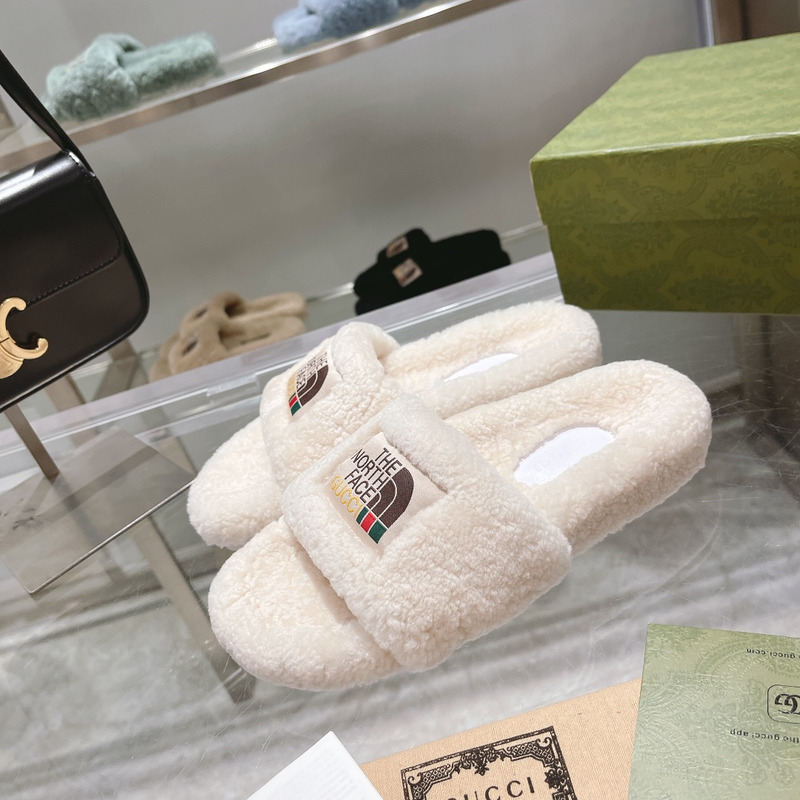 g*u*i x the n0*h F**e shearling slides white