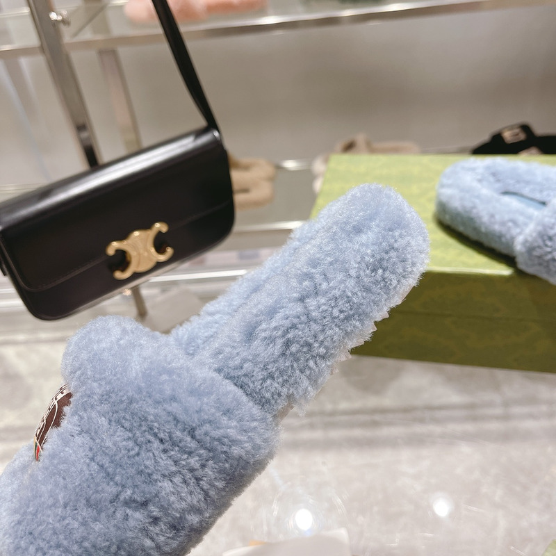 g*u*i x the n0*h F**e shearling slides blue
