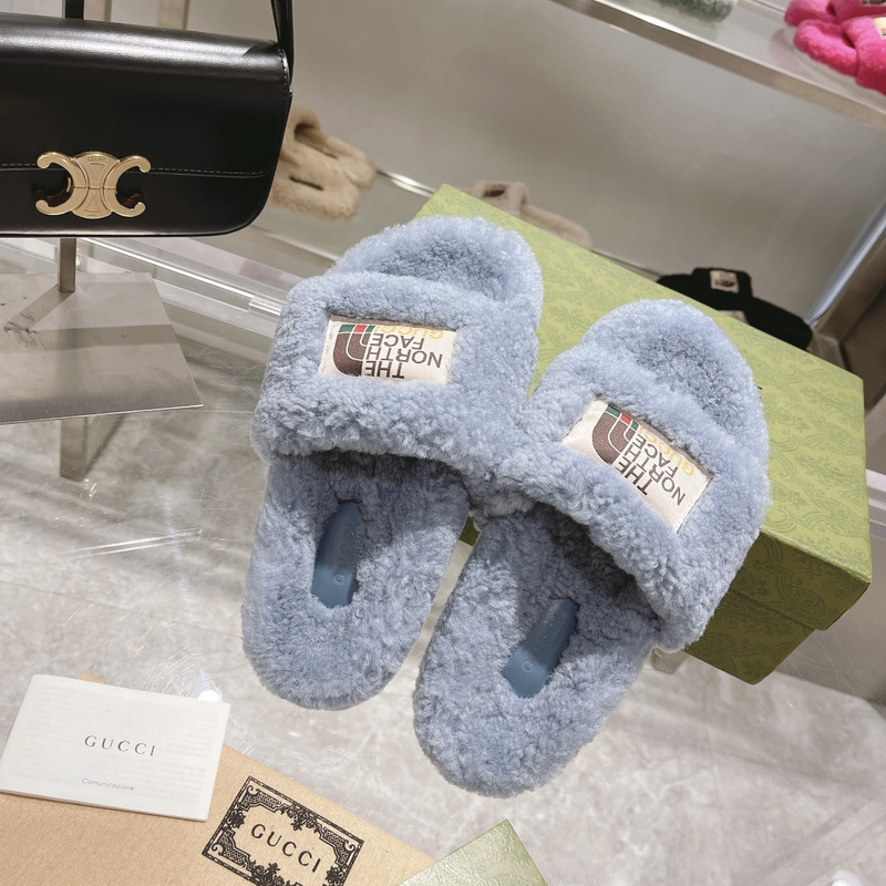 g*u*i x the n0*h F**e shearling slides blue