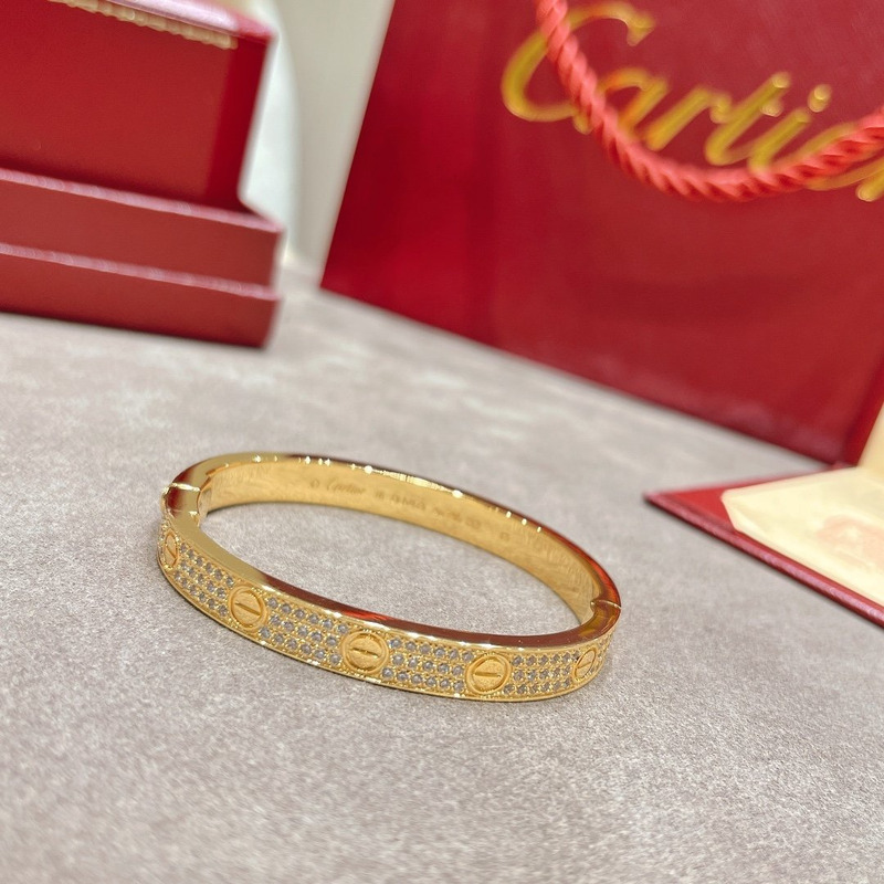 cartier Di*m*nd paved love bangle bracelet in yellow gold