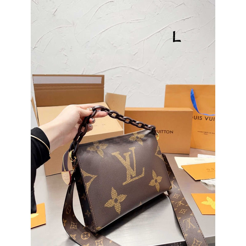 l**is V*t*n toiletry bag with logo