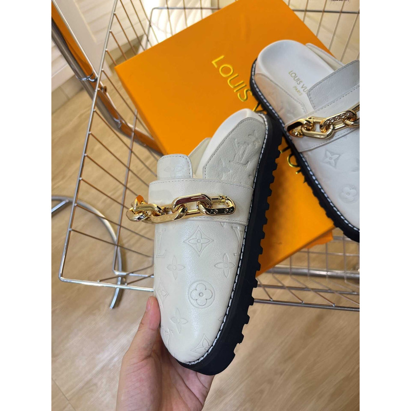 l**is V*t*n fireplace chain in white loafers