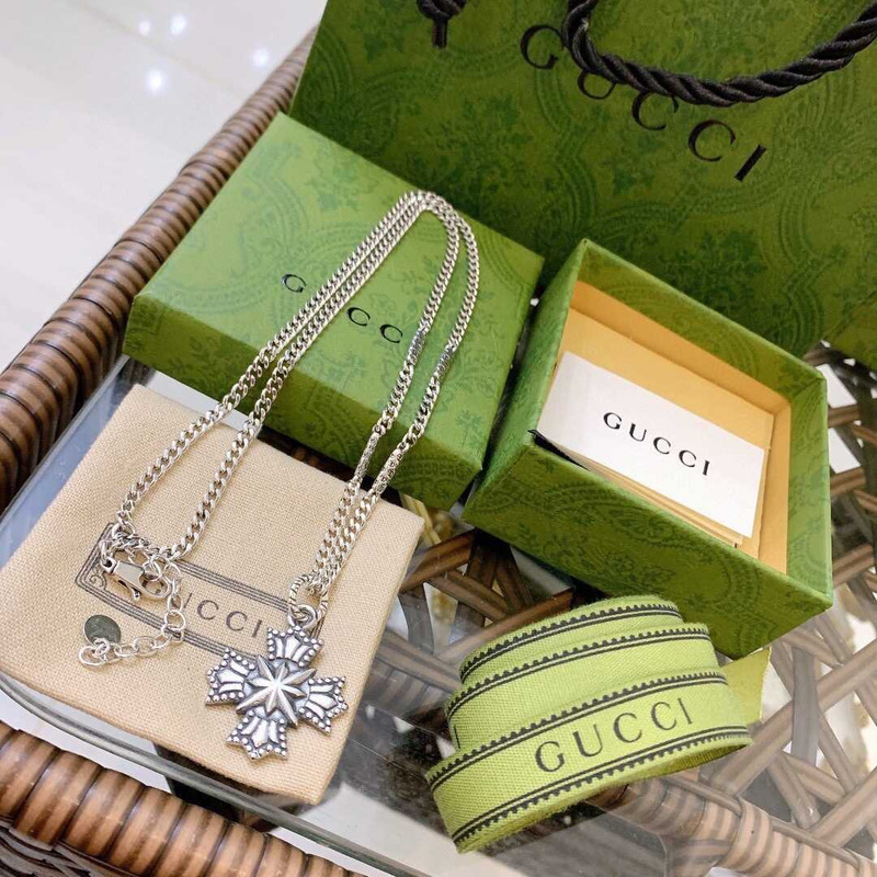 G*u*i crucifixion necklace