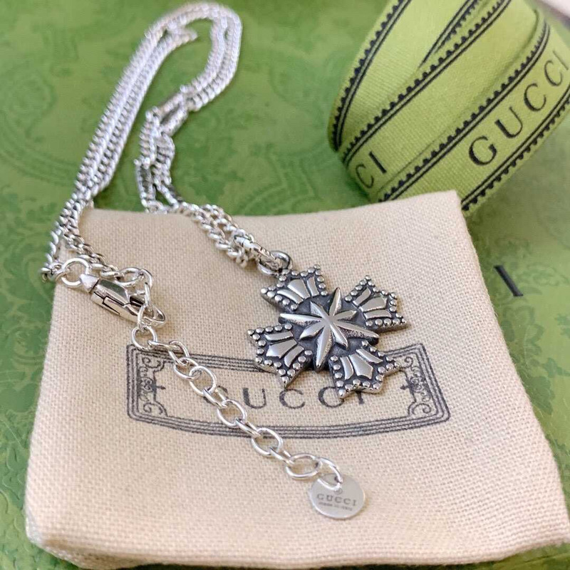 G*u*i crucifixion necklace