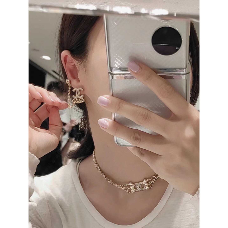 Ch*el metal and crystal earrings