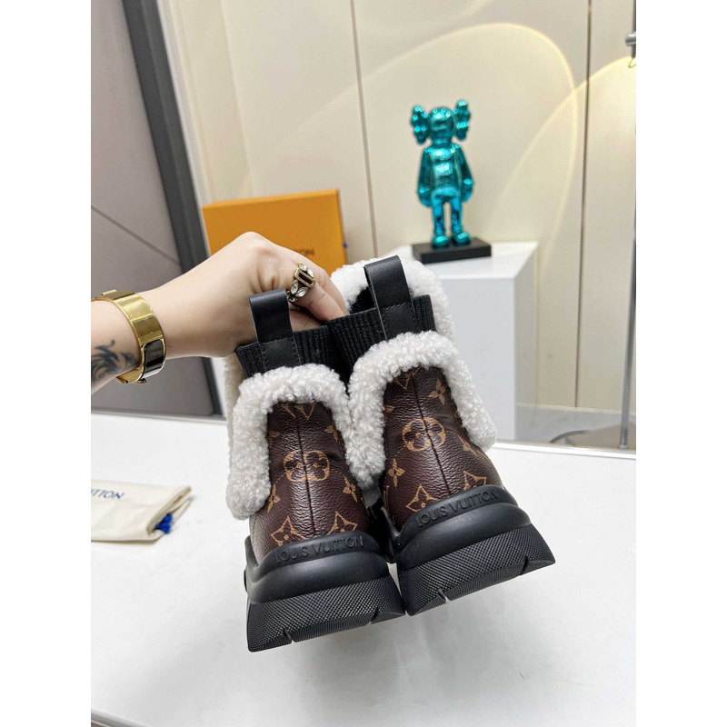 l**is V*t*n ski ruby flat ankle boot monogram