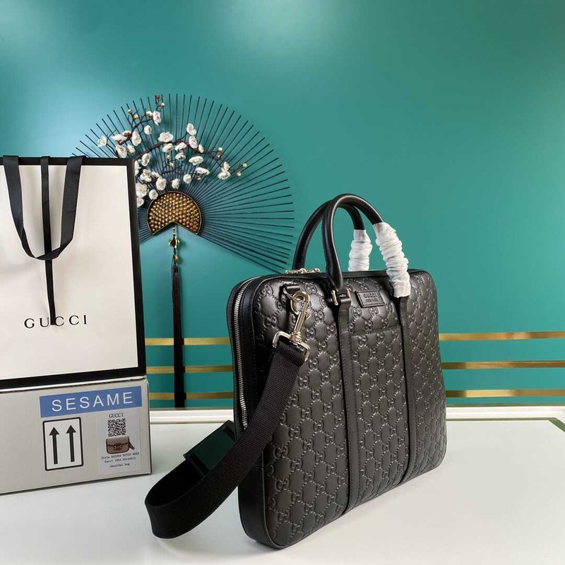 g*u*i gg S*p*e embossed leather briefcase black