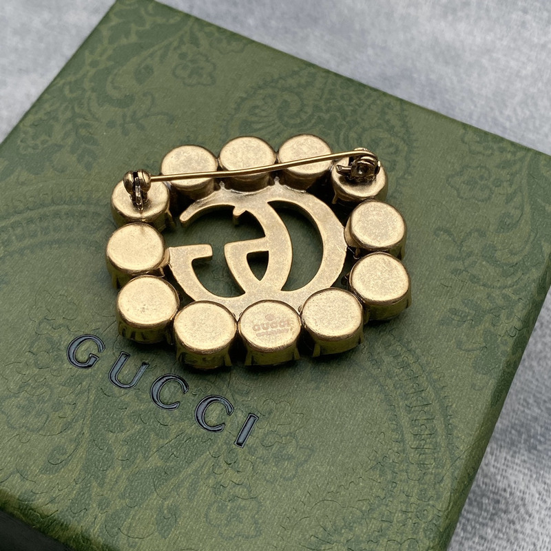 G*u*i metal double g brooch with crystals