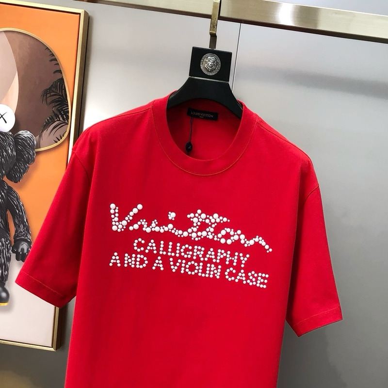 l**is V*t*n t-shirt red calligraphy and a violin case