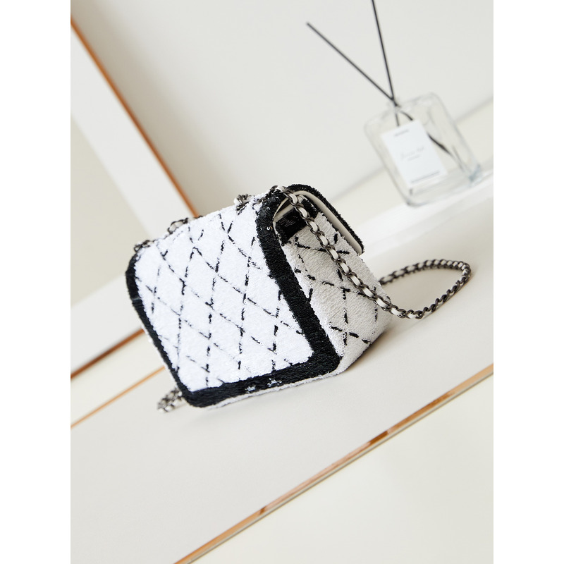 Ch*el large palatine capsule sequins & gold metal white and black