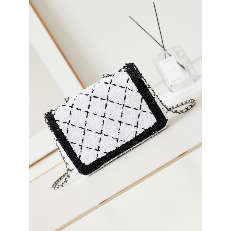 Ch*el large palatine capsule sequins & gold metal white and black