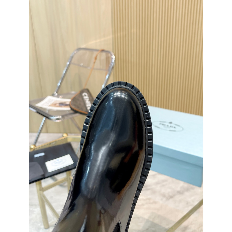 Pra*a metal triangle logo chelsea boots in black