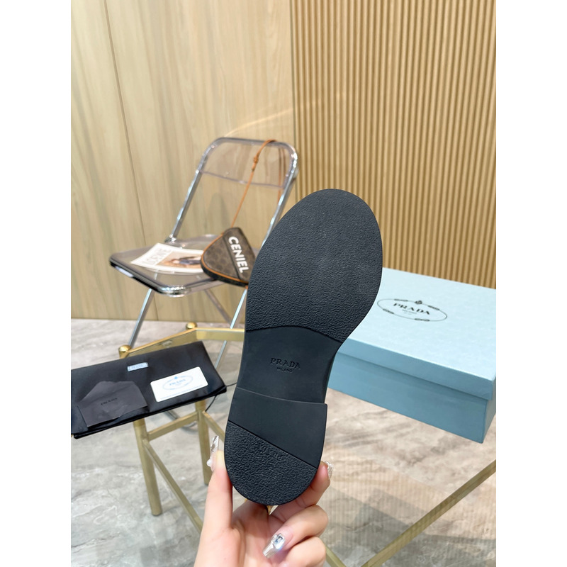 Pra*a metal triangle logo chelsea boots in black