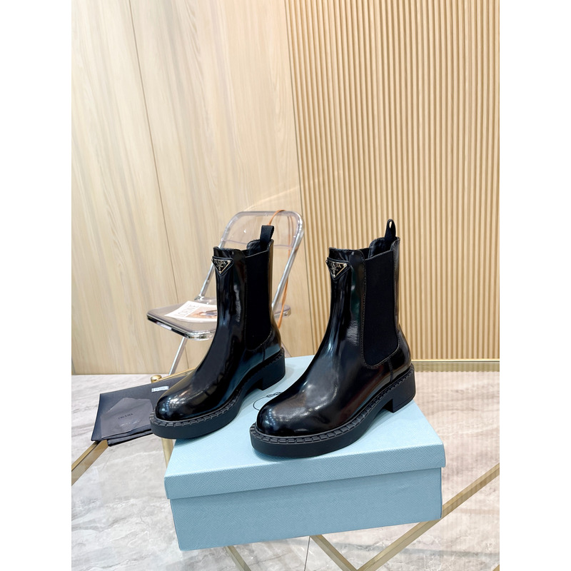 Pra*a metal triangle logo chelsea boots in black