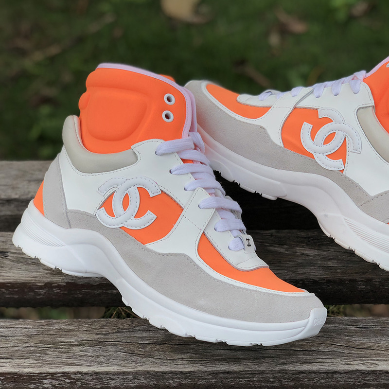 Ch*el calfskin & velvet high top sneaker in orange & white