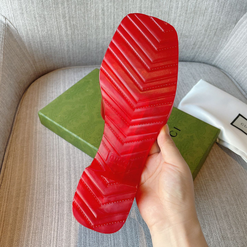 G*u*i plastique logo-embossed rubber mules