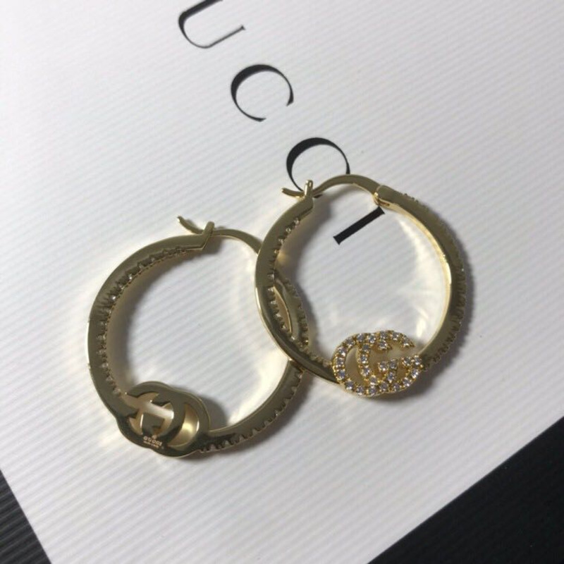 G*u*i earrings