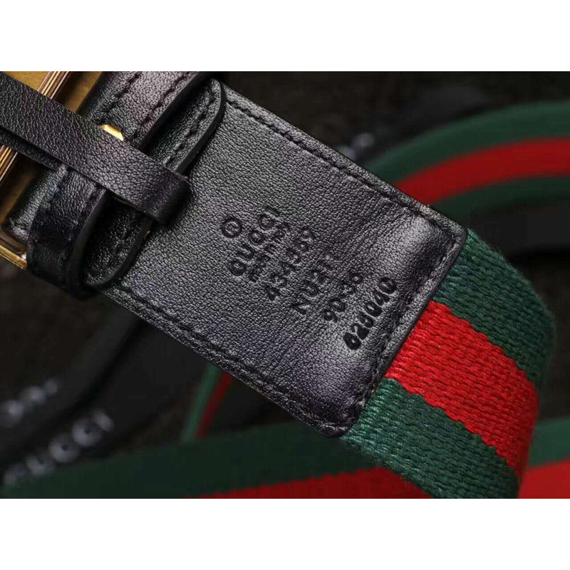 G*u*i canvas web green belt with feline head