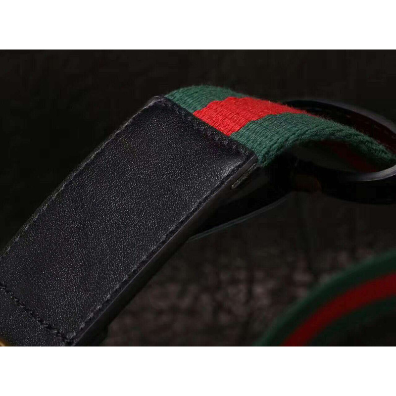 G*u*i canvas web green belt with feline head