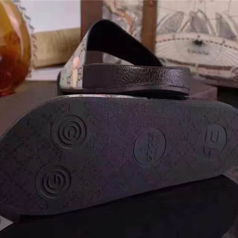 G*u*i bird and flower flip flops