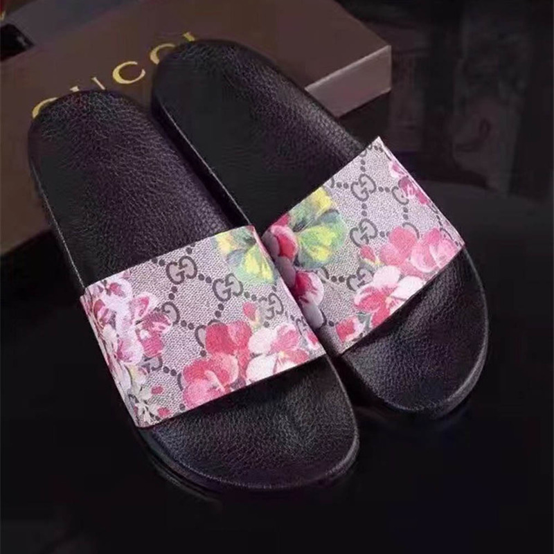 G*u*i bird and flower flip flops