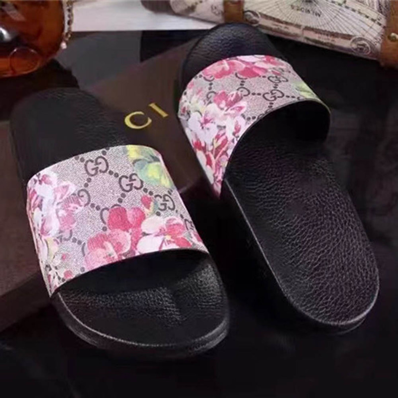 G*u*i bird and flower flip flops